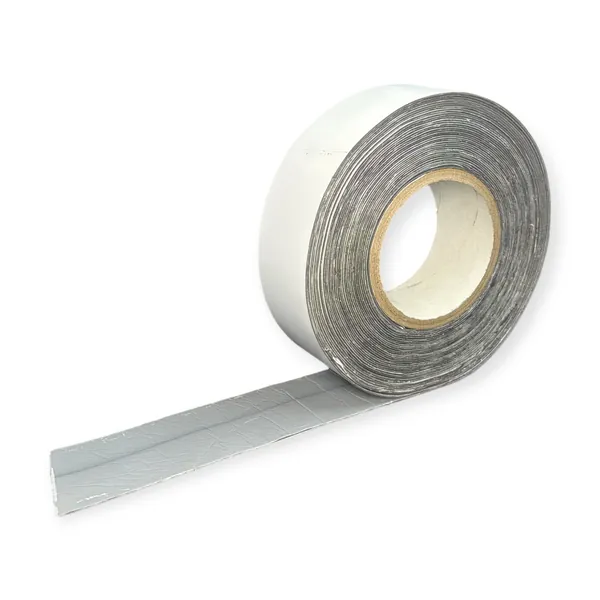 K3050 partly unrolled, showing the white PVDF face and the butyl underside